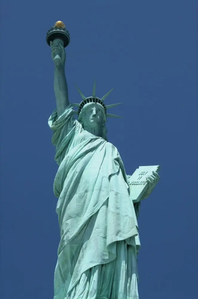 The Statue of Liberty against a clear blue sky